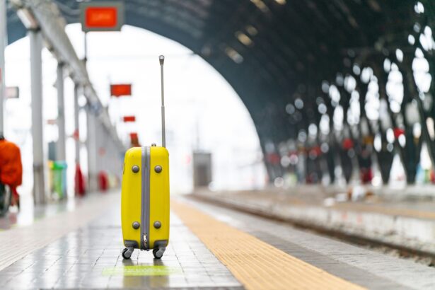 Carry-on suitcase on a European train platform — compact luggage is essential for train travel