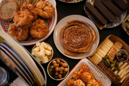 A spread of international dishes — sushi, pasta, tacos, dim sum and curry